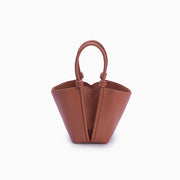 Bolsa de couro feminina Caramelo estilo Bucket, marca Soleah, posição da bolsa de frente com alça de mão